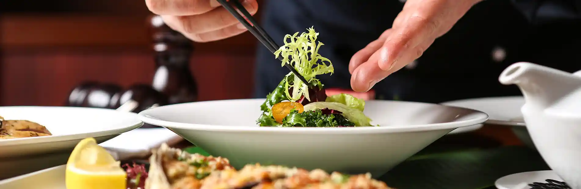 A vibrant salad bursting with colors, featuring crisp mixed greens, juicy cherry tomatoes, crunchy cucumber slices, creamy avocado chunks, and tangy vinaigrette dressing drizzled on top